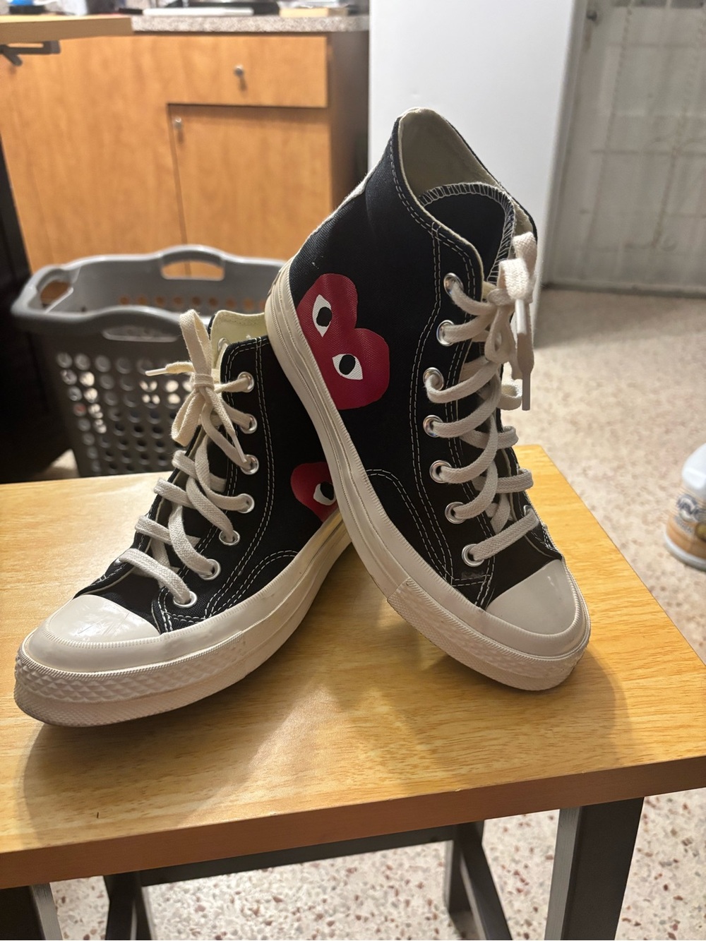 Comme des Garçons PLAY x Converse Chuck 70 high-top sneakers in black.